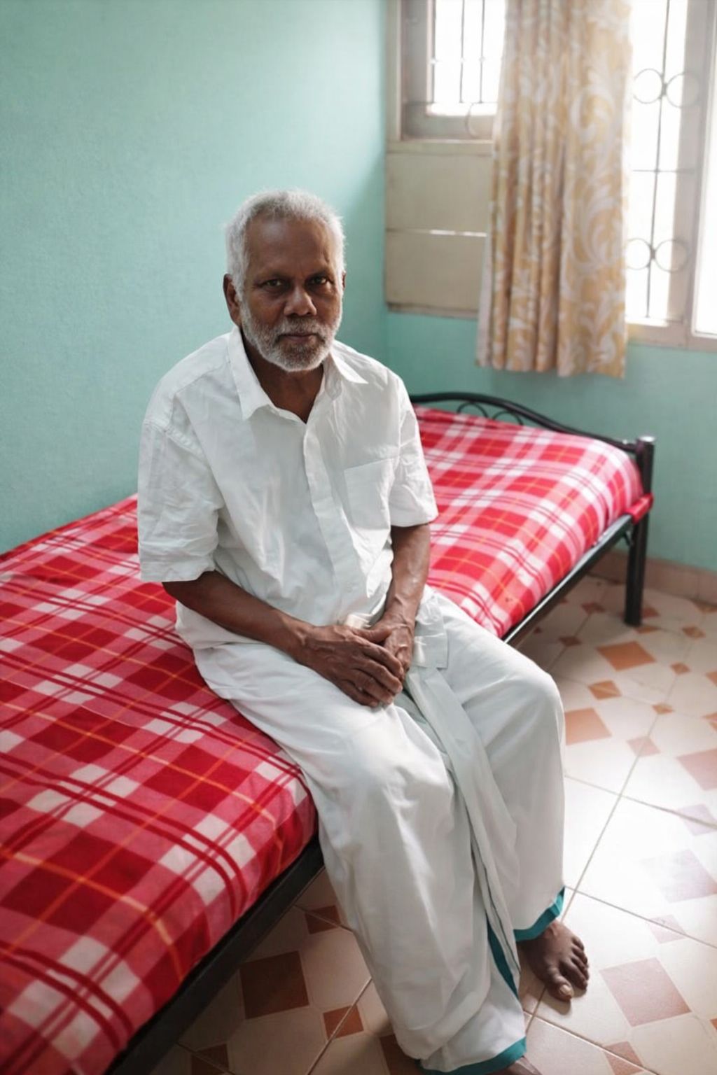 Cheerful elderly grandfather with warm smile in comfortable surroundings at John Bosco